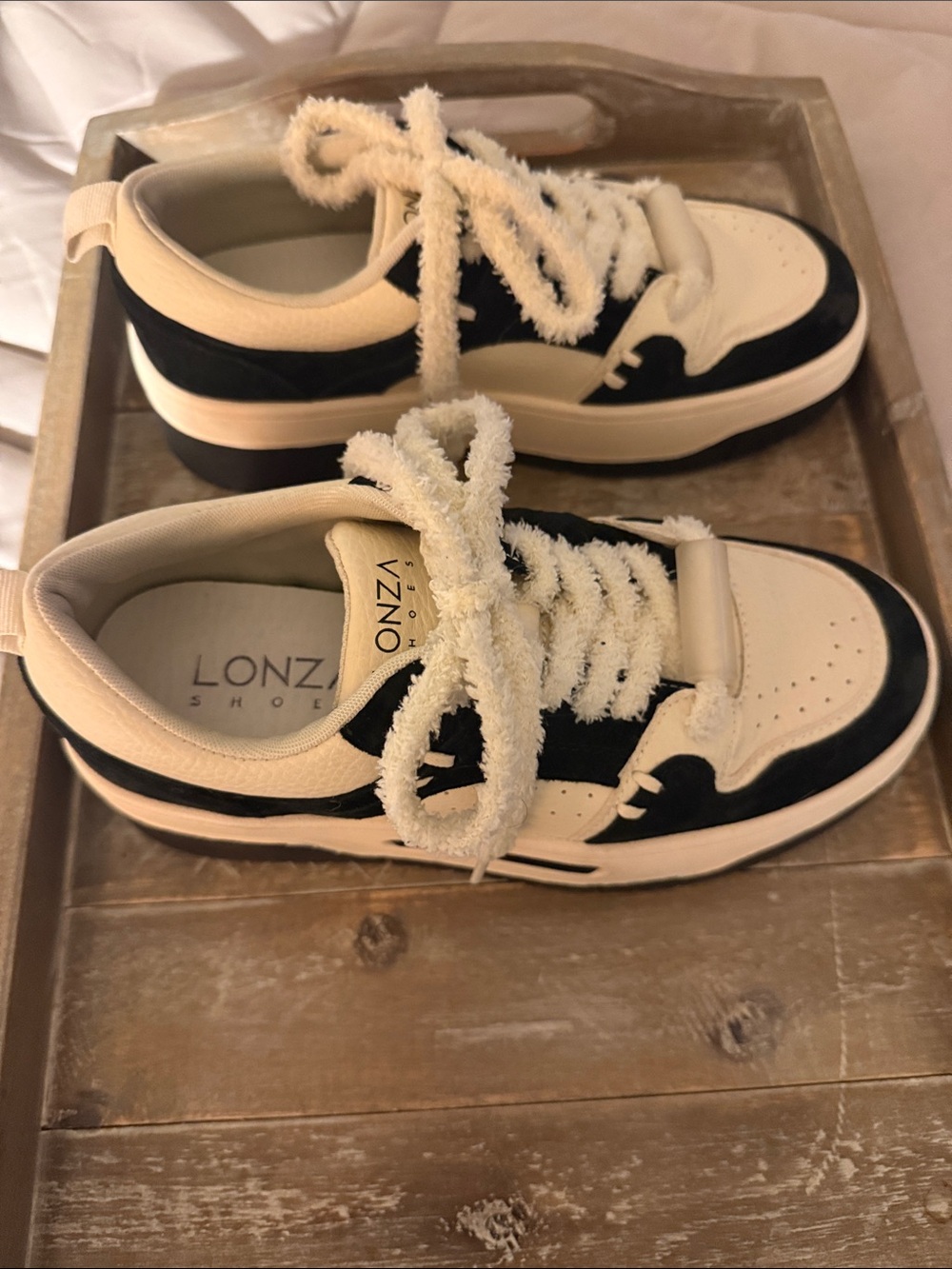 Lonza woman’s Black and Cream Low-Top Sneakers with Fuzzy Laces